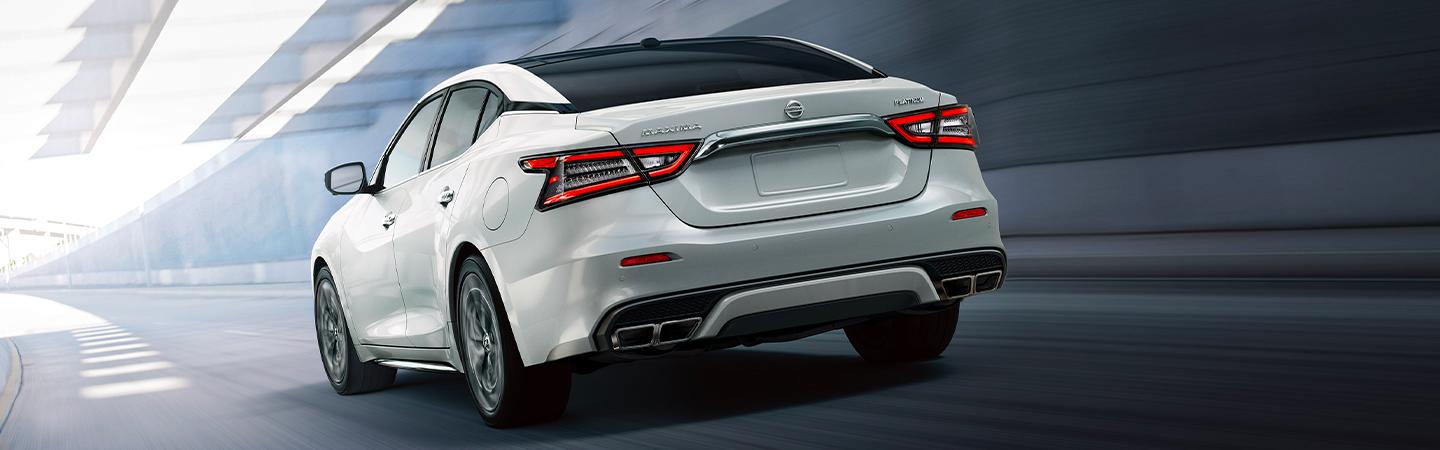 Nissan Maxima sedan with black roof,