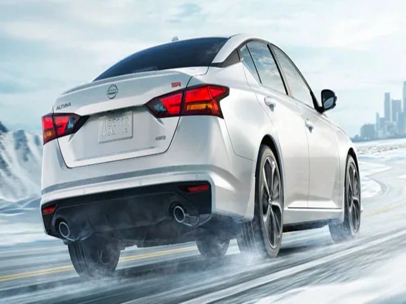 nissan car driving on road